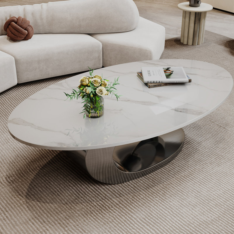 Table basse en marbre avec base sculpturale en acier inoxydable