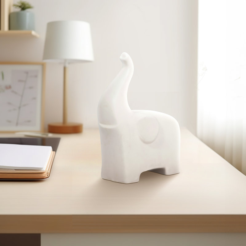 Figurine Stoneware and Ceramic Elephant with Modern Minimalist Silhouette and Raised Trunk Detail for Decorative Display and Animal-Inspired Artistic Accent