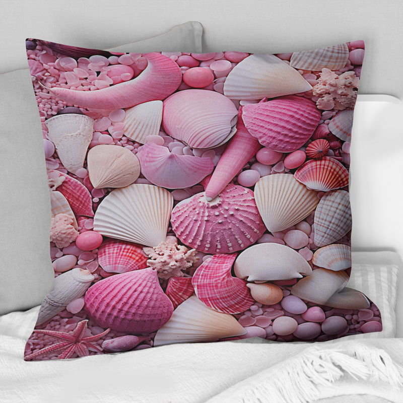 Coussin rose à imprimé coquillage rose sur la plage