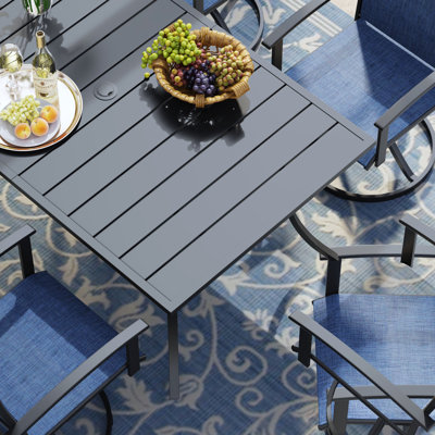Petterson Rectangular Patio Dining Set With Stackable PVC-coated polyester Chair