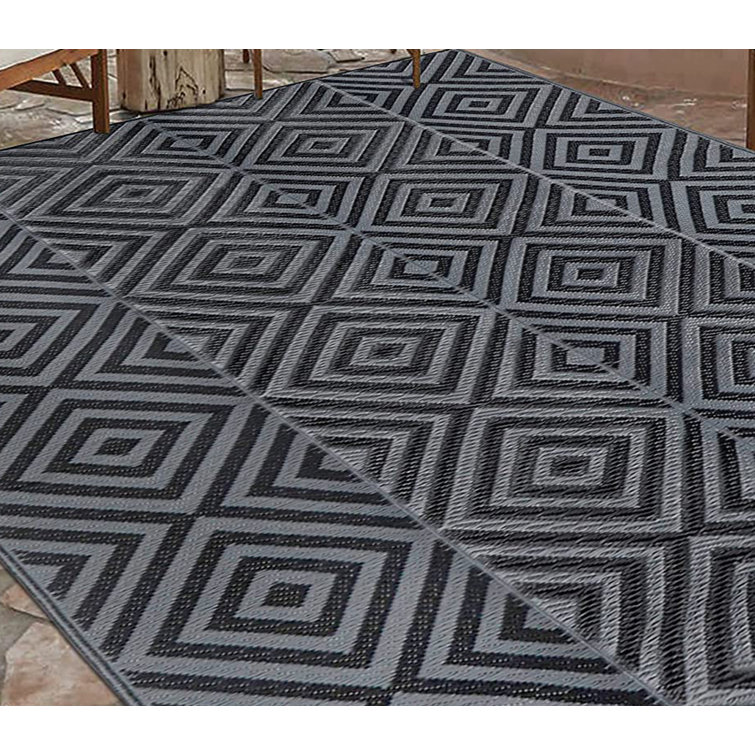 https://assets.wfcdn.com/im/33425571/resize-h755-w755%5Ecompr-r85/2399/239934194/Reversible+Mats%2C+Outdoor+Patio+Rugs%2C+Plastic+Straw+Rug%2C+Modern+Area+Rug.jpg