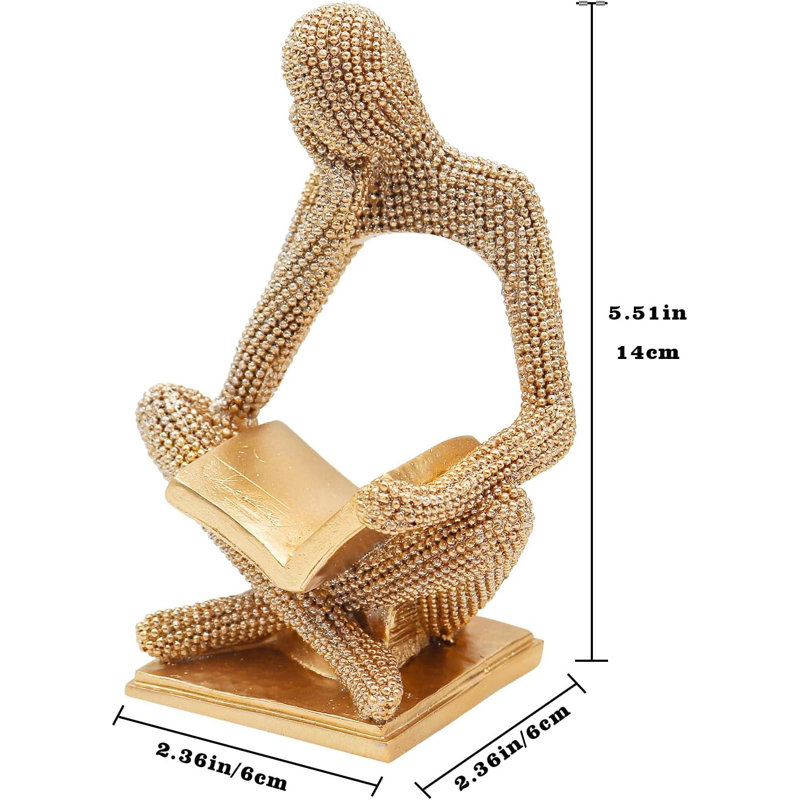 Statue féminine brillante en lecture dorée
