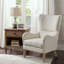 Fauteuil à oreilles Ari Swoop - Accoudoir rond - Passepoil - Coussin lâche - Biscuit récupéré
