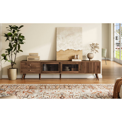 Meuble télé 76 po à grain de bois avec portes en verre pour téléviseurs de 85 pouces, console de divertissement dans la chambre à coucher, fonctionnalité lisse et conception élégante avec armoires de rangement modernes et minimalistes