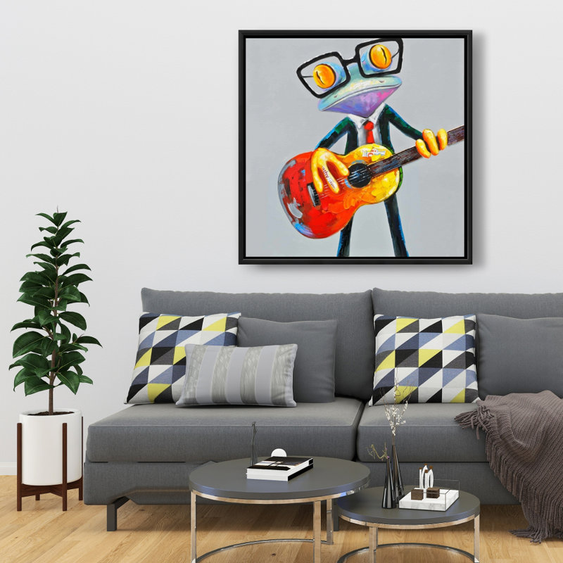 Drôle de grenouille jouant de la guitare