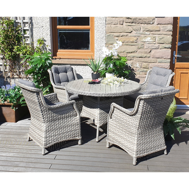 Spaldings 4 - Person Wicker Patio Dining Set with Round Table , Cushions Included
