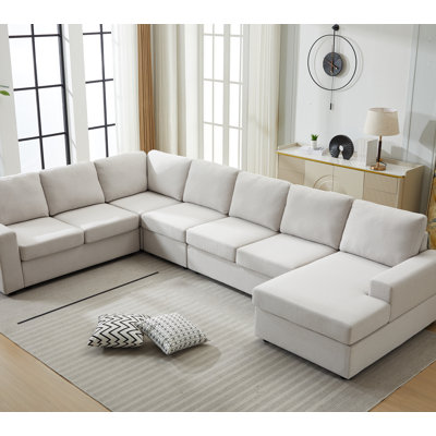 Grand ensemble de canapé modulaire en forme de L avec composants amovibles, revêtement confortable et jetés décoratifs pour les intérieurs contemporains
