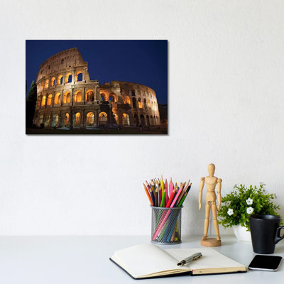 Italy, Rome, Colosseum. Night Scene At Landmark. by Jaynes Gallery - Wrapped Canvas Print