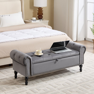 Tufted Upholstered Storage Bench Featuring Nailhead Accents and Curved Arm Design