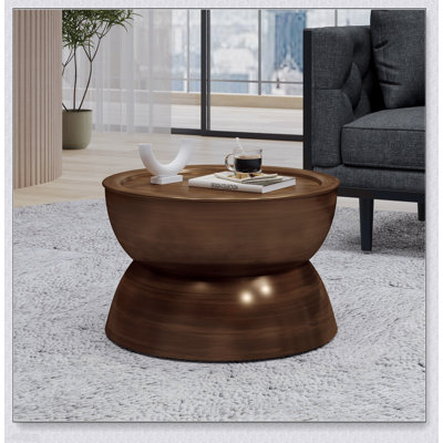 Élégante table basse martelée en métal avec un design de sablier et une fabrication en fer durable, parfaite pour un décor moderne et rétro