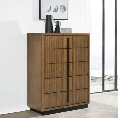 5-Drawer vertical dresser with ribbed wood panels and sleek dark handles combines textured style with space-saving bedroom storage