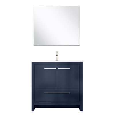 36 po L x P 20 po. Meuble-lavabo bleu marine avec comptoir en quartz blanc, robinet en nickel brossé et miroir 28 po