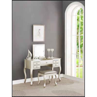 Ensemble de coiffeuse classique avec tabouret, tiroirs, miroir ouvert et pieds uniques pour un mobilier de chambre élégant