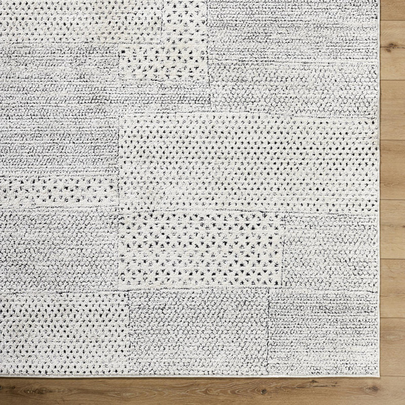 Livabliss 8' x 10' Ivory and Black Synthetic Patchwork Area Rug