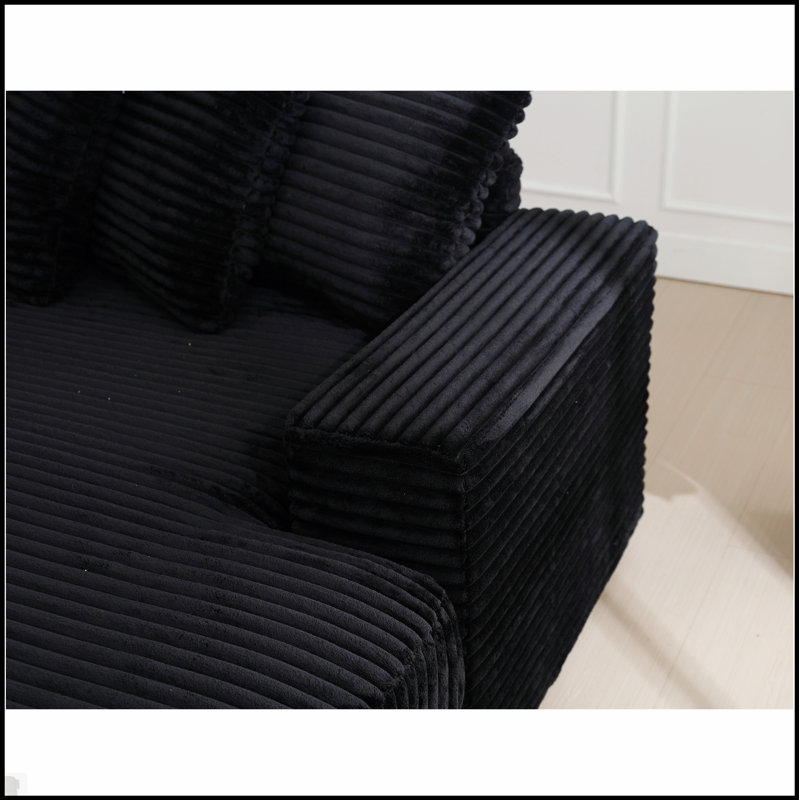 Canapé confortable surdimensionné en velours côtelé avec plusieurs coussins pour la détente et le style moderne
