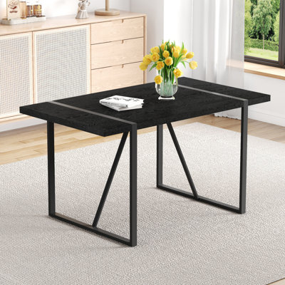 A 55-Inch minimalist retro rectangular dining table with a black textured top with Inset Rectangular Black Metal legs.Minimalist MDF Tabletop.Meeting
