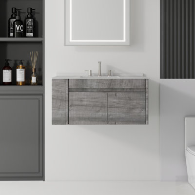 Meuble-lavabo flottant avec lavabo, porte à fermeture en douceur et comptoir en marbre de culture durable, idéal pour les salles de bain modernes et peu encombrantes