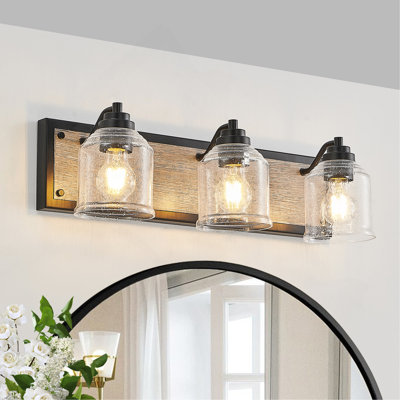 Luminaire de meuble-lavabo 23 po, applique murale de salle de bain 3 lumières avec abat-jour en verre bullé transparent, finition grain de bois noir, design industriel moderne pour salle de bain ou salle d'eau (ampoules non incluses)
