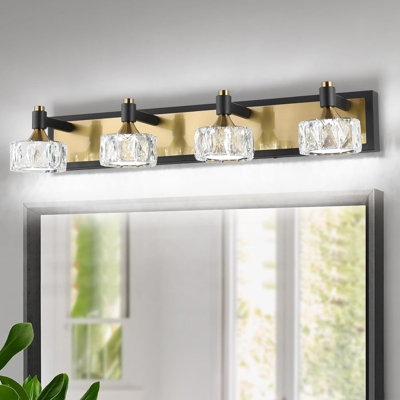 Applique murale de salle de bain moderne à DEL en cristal à intensité variable avec finition noire et dorée - luminaire écoénergétique au-dessus d'un miroir