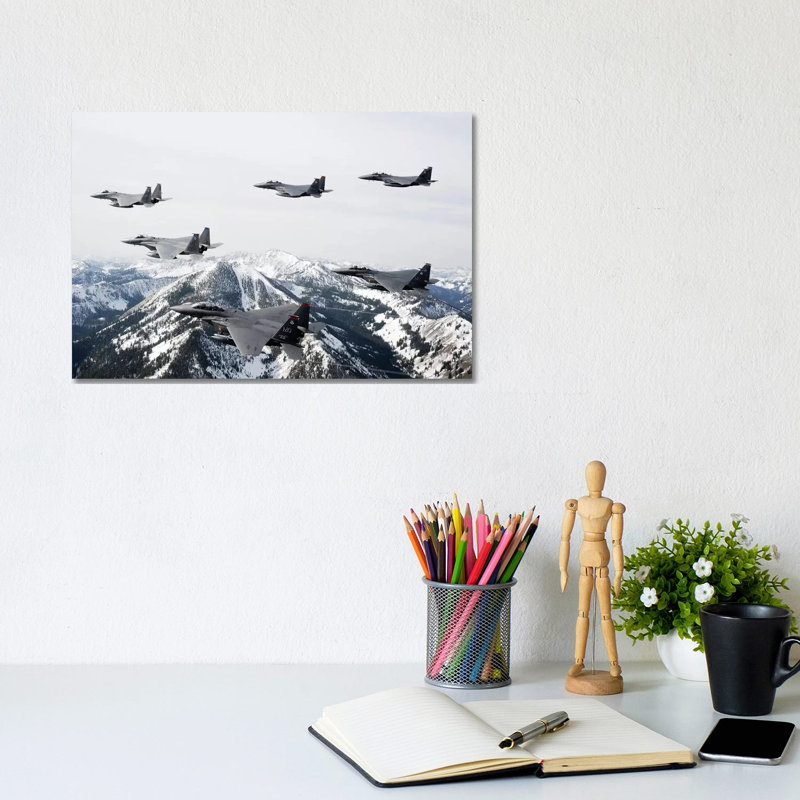 A Six-Ship Formation Of Aircraft Fly Over The Sawtooth Mountains In Idaho by Stocktrek Images - Wrapped Canvas Print