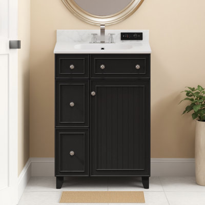 Le meuble-lavabo de 24 pouces avec lavabo en céramique, équipé de 2 tiroirs et d'une porte, offre un espace de rangement pratique pour répondre aux besoins de lavage et de rangement de la salle de bain, conception simple et pratique