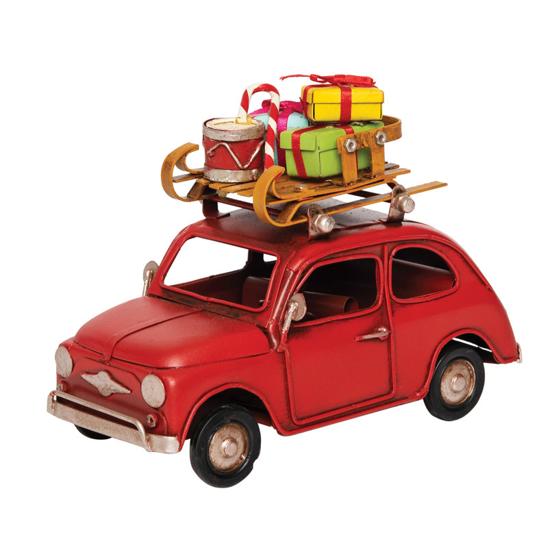 Figurine de voiture rouge avec bagage