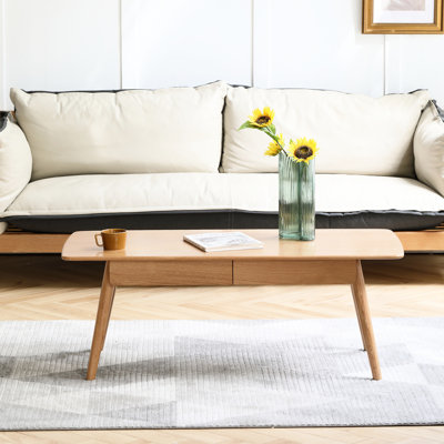 Table basse en chêne massif naturel 100 x 50 x 45 cm, avec tiroir de rangement pratique et montage facile.