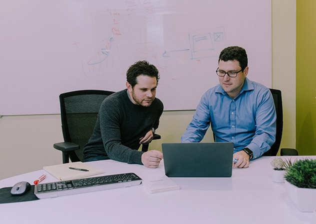 Two employees meeting in a conference room