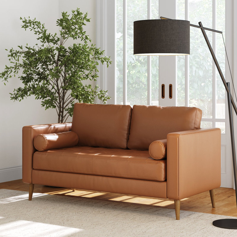 Canapé en cuir brun clair avec coussin de banc capitonné et structure en bois massif