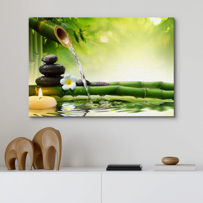 «Zen Stones Rocks and A Flower Over Bamboo on a Lake with a Waterfall», reproduction de photo sur toile tendue