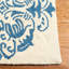 Tapis ivoire / bleu en laine crocheté à la main Daijah-22226368