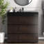 Meuble-lavabo élégant en noyer avec lavabo noir, solution de rangement moderne pour salle de bain