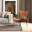 Fauteuil à oreilles rembourré en cuir avec coussins