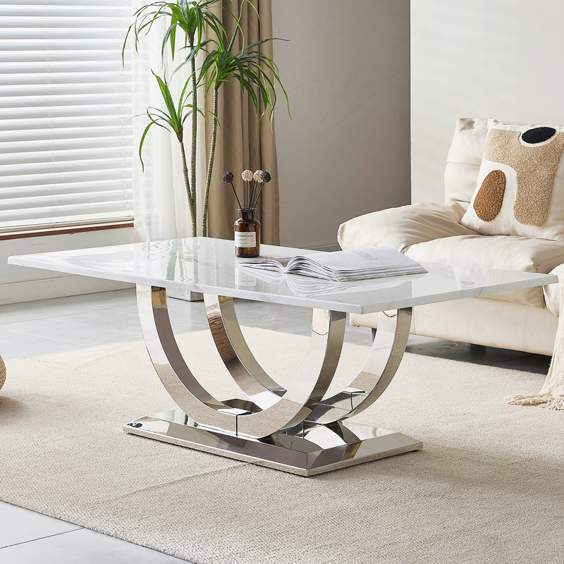 Table basse rectangulaire moderne de 50,4 pouces, plateau en panneau de fibres à densité moyenne à motif marbré, base en acier inoxydable argenté.