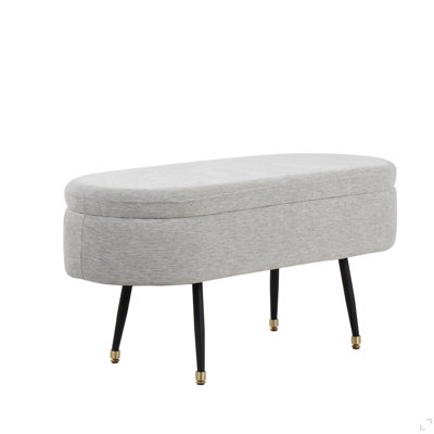 Banc de rangement contemporain en métal noir et tissu gris clair avec accent en métal doré