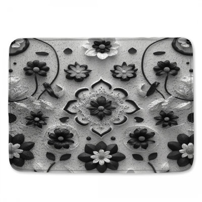 Tapis de bain noir à motif floral