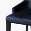 Fauteuil capitonné à dossier