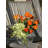 Ranunculus, Hydrangea and Eucalyptus Arranged in a Clear Glass Vase