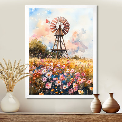 Moulin à vent rose et jaune dans un champ de fleurs sauvages - Tableau encadré représentant une grange, une ferme ou un ranch