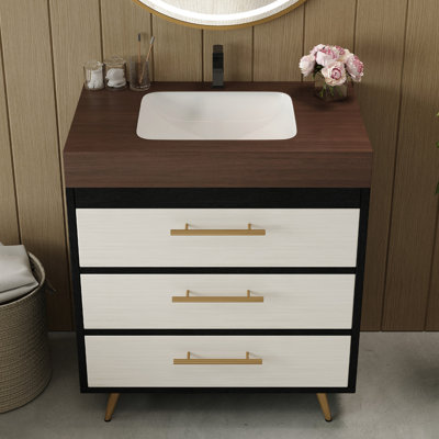 Meuble-lavabo minimaliste avec lavabo vasque en céramique et comptoir en pierre frittée. Il comprend deux tiroirs à fermeture en douceur pour faciliter l'organisation. Le comptoir de meuble-lavabo peut supporter jusqu'à 50 lb de style moderne