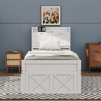 Wooden Bed With A Storage Headboard Incorporating Electrical Outlets