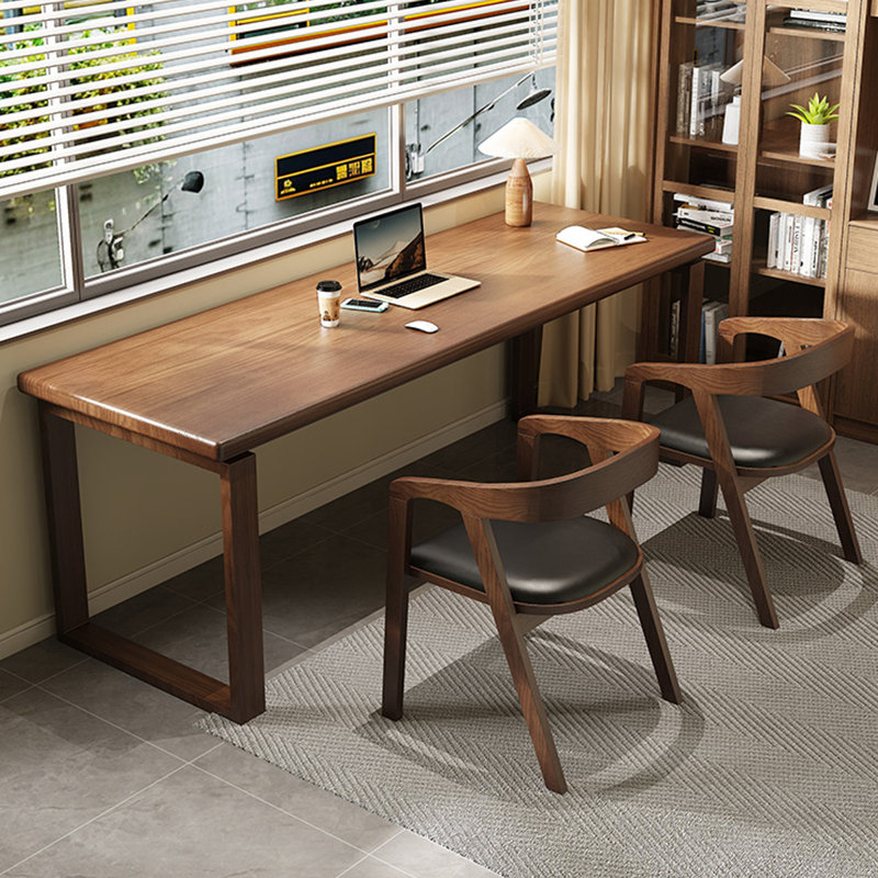 A simple rectangular solid wood desk in walnut color, 29.53" H x 62.99" W x 23.62" D