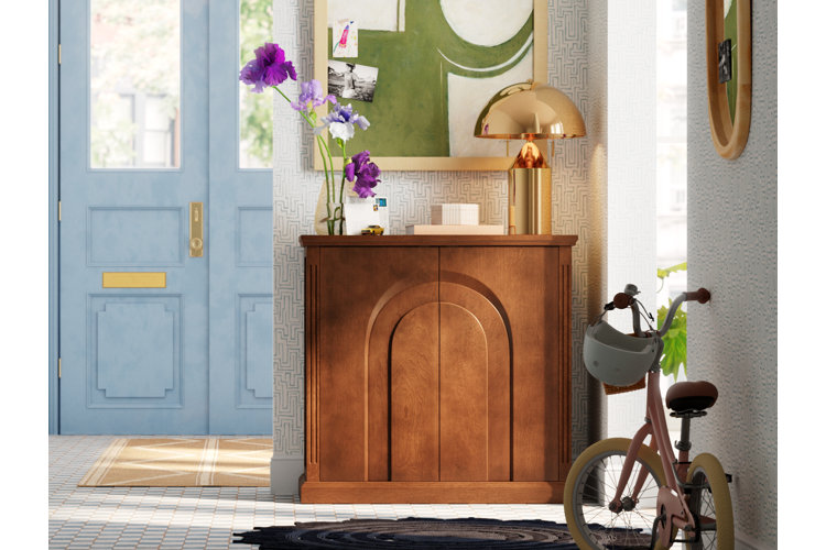 modern entryway with patterned floor tile, geometric wallpaper, and a wood console table.