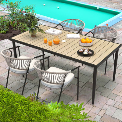Caulin 4 - Person Wicker Patio Dining Set with Rectangular Table , Cushions Included