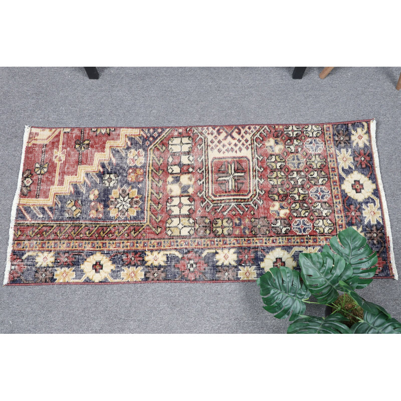 Handmade Vintage Turkish Area Rug With Rich Red and Blue Floral Design Featuring Unique Geometric Patterns Ideal for Any Space