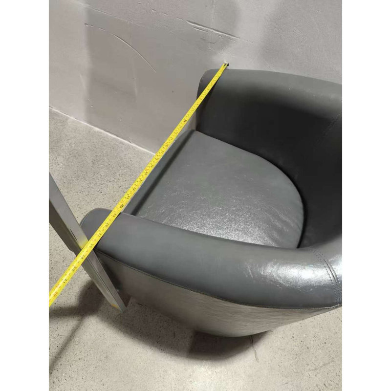 Fauteuil demi-tonneau luxueux en similicuir avec repose-pieds