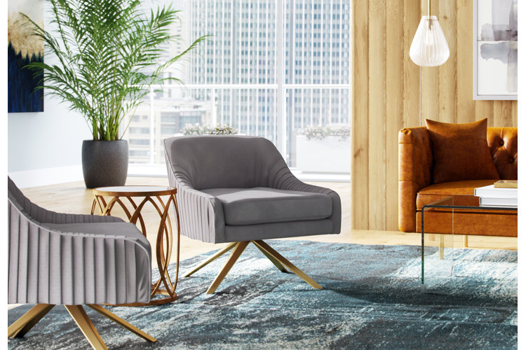 mid-century modern style living room with gray accent chairs and a geometric end table