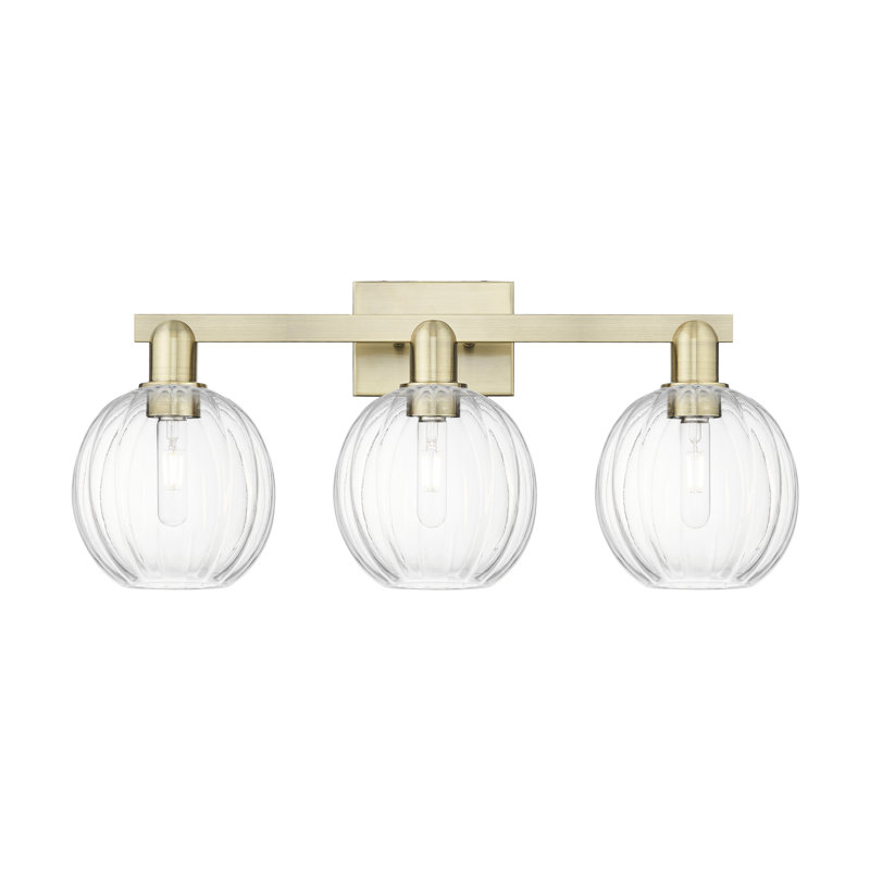 Eldon - 3 Light 26" Globe Shade Bath Vanity Light, Clear, Antique Brass