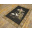 Tapis noué à motif floral antique