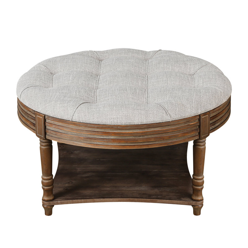 Large round ottoman coffee table in light grey, 2-tier design with button tufted top & wood storage shelf